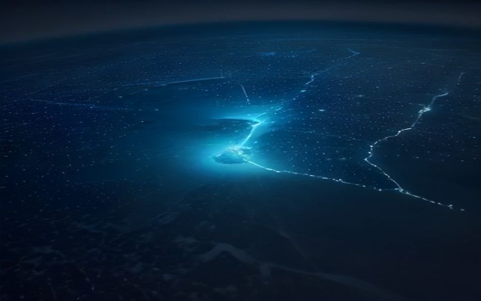 Distributed edge AI IoT network nodes with glowing connections across aerial digital landscape at night